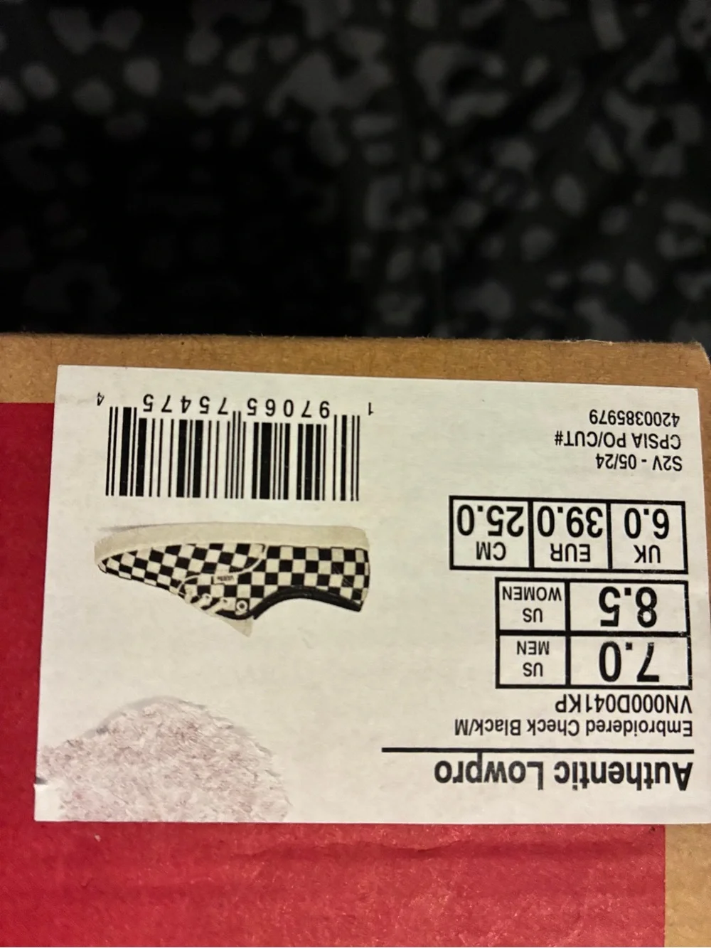 Vans Black and White Checkerboard Slip-On Sneakers